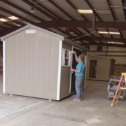 Valley Structures – Paint Your Shed Valley Structures employee painting a shed in the Dayton shop