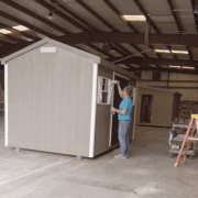 Valley Structures – Paint Your Shed Valley Structures employee painting a shed in the Dayton shop