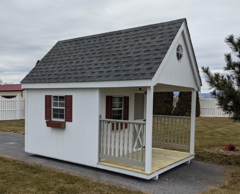 White shed with red trim