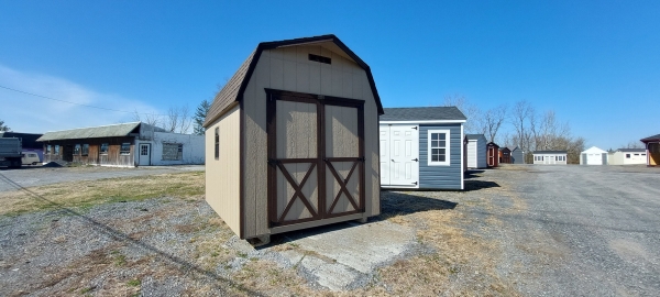 picture of two sheds, one beige and one blue