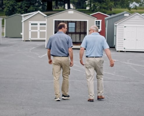 Owner giving a tour of the Harrisonburg sheds lot to a custoemr