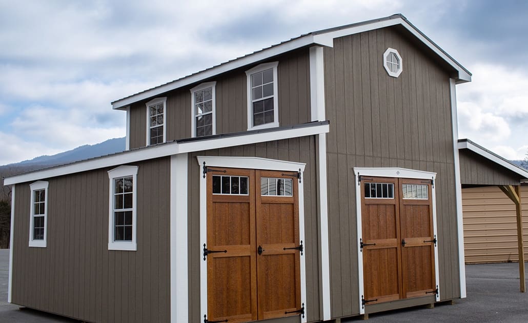 FullAtticCottage12x20 exterior shot of a 12x20 ft two-story full attic cottage with an addition
