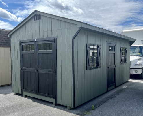 Cost-effective sturdy green shed used for storage.