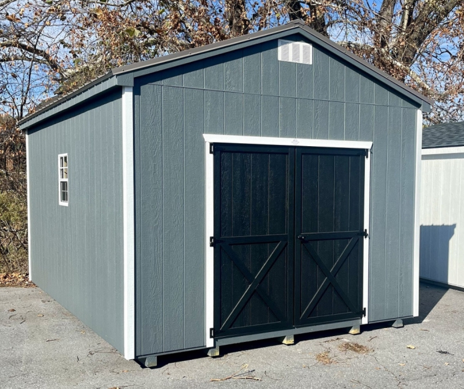 Exterior Of A Green Shed With Black Doors & White Trim