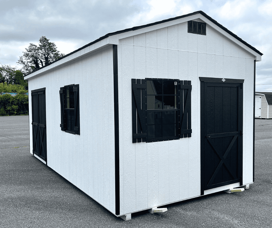 VS - Featured Blog Image White shed with black shutters and doors on pavement