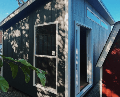 Classic shed in blue with white trim